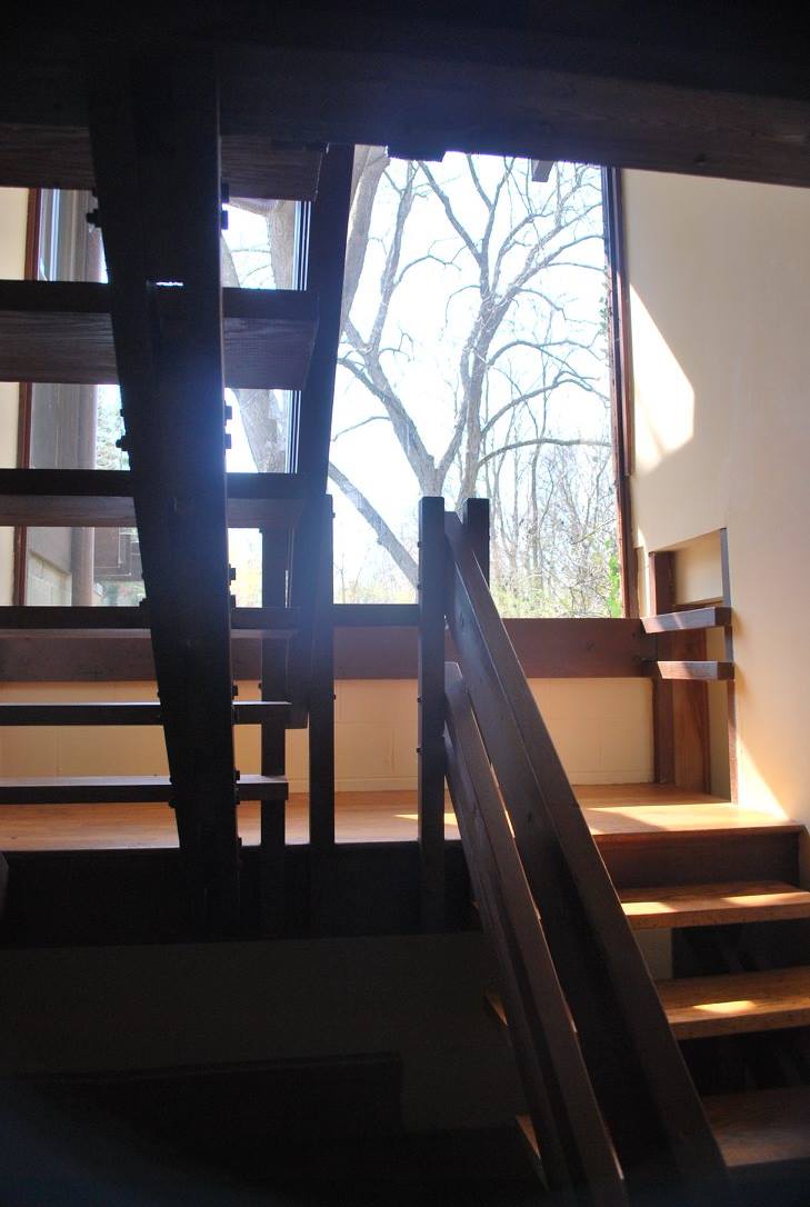 Plate glass window & floating stairs from basement